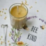 Beeswax candle in small glass jar