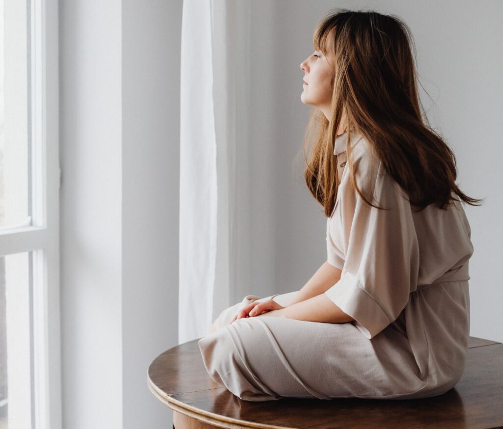 girl looking out window